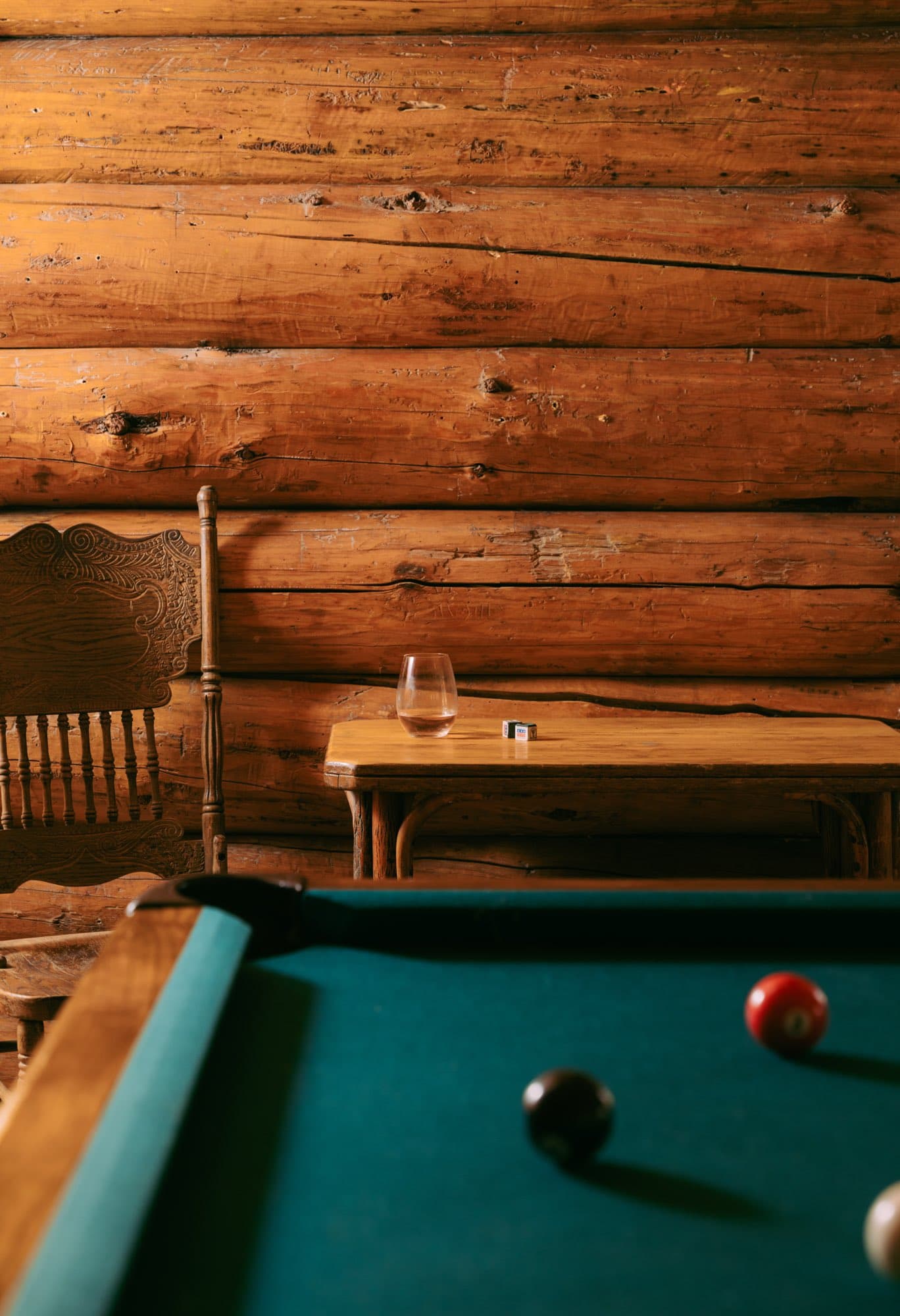 The pool table against the log wall
