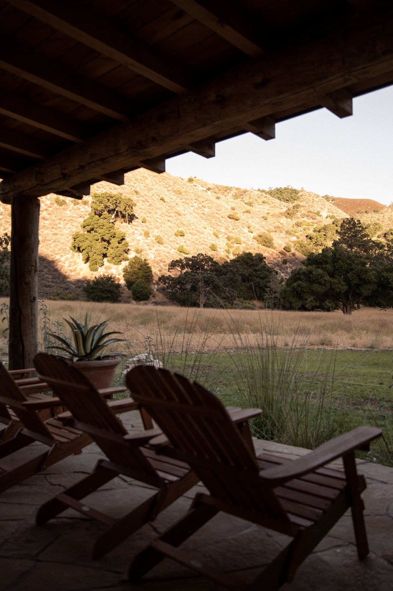 Chairs on the porch, looking out at the hillside