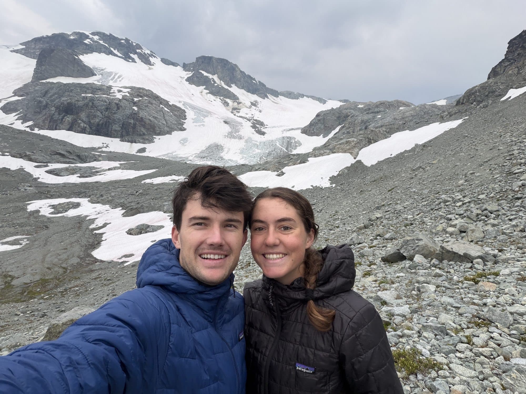Audrey and Ben below a glacier in the mountains
